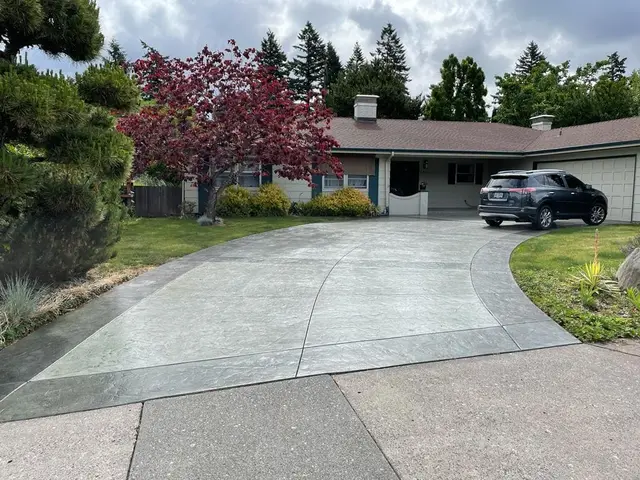Stamped concrete curved driveway with textured finish in Portland OR – Glorious Stone Construction