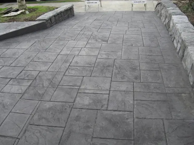 Stamped concrete patio with stone retaining walls in Gresham OR – Glorious Stone Construction